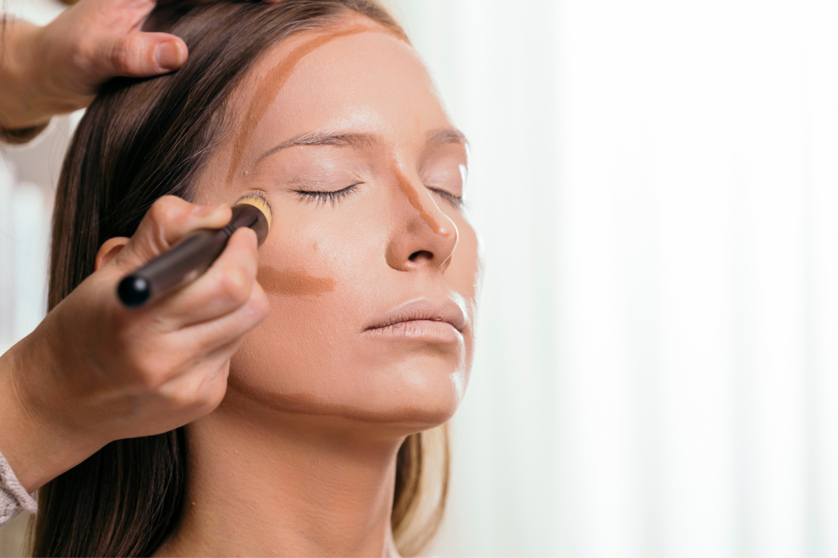 Close up of complexion makeup being applied during a focused makeup lesson