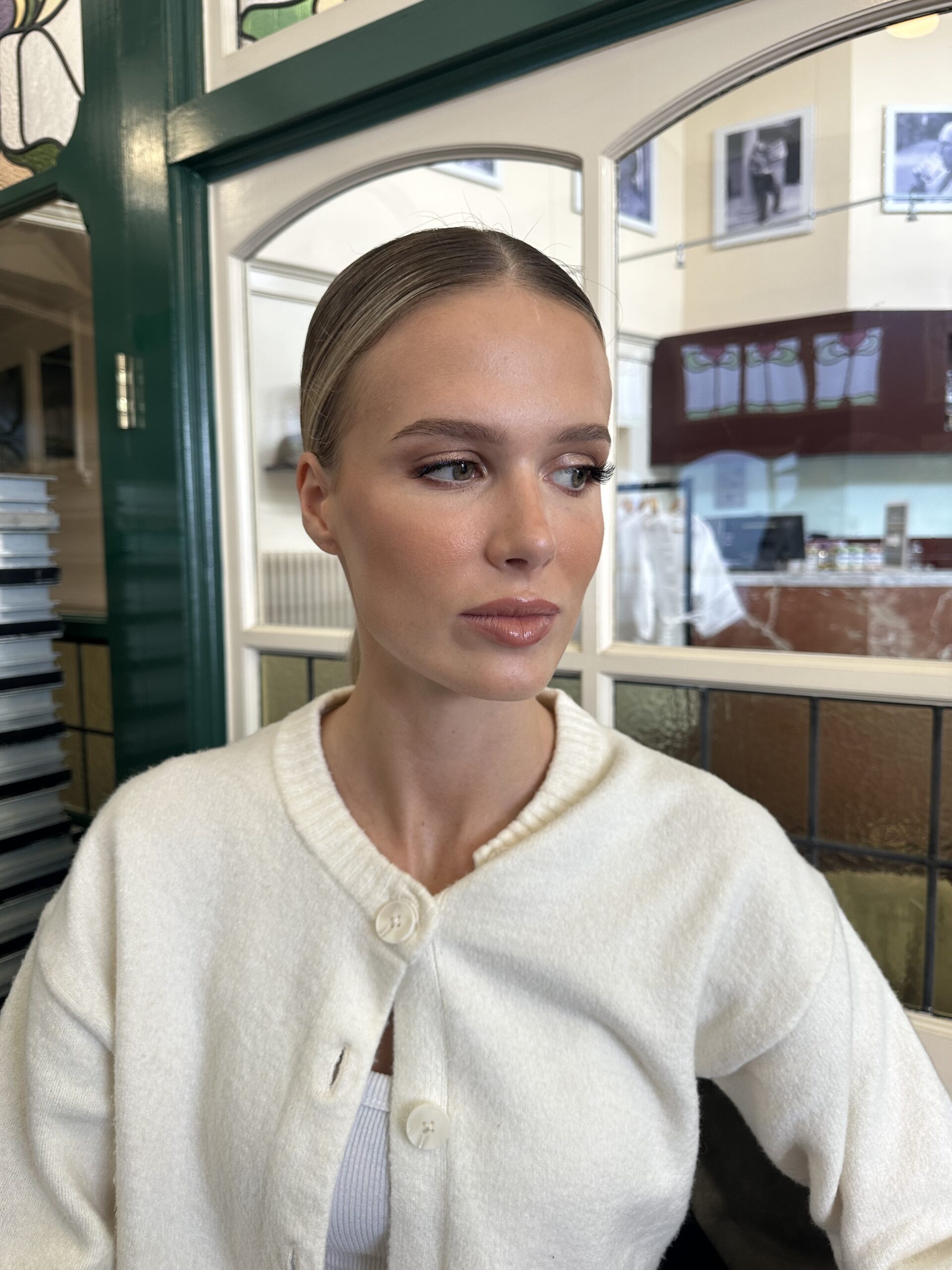 Softly defined eye makeup and rose lips on a blonde model