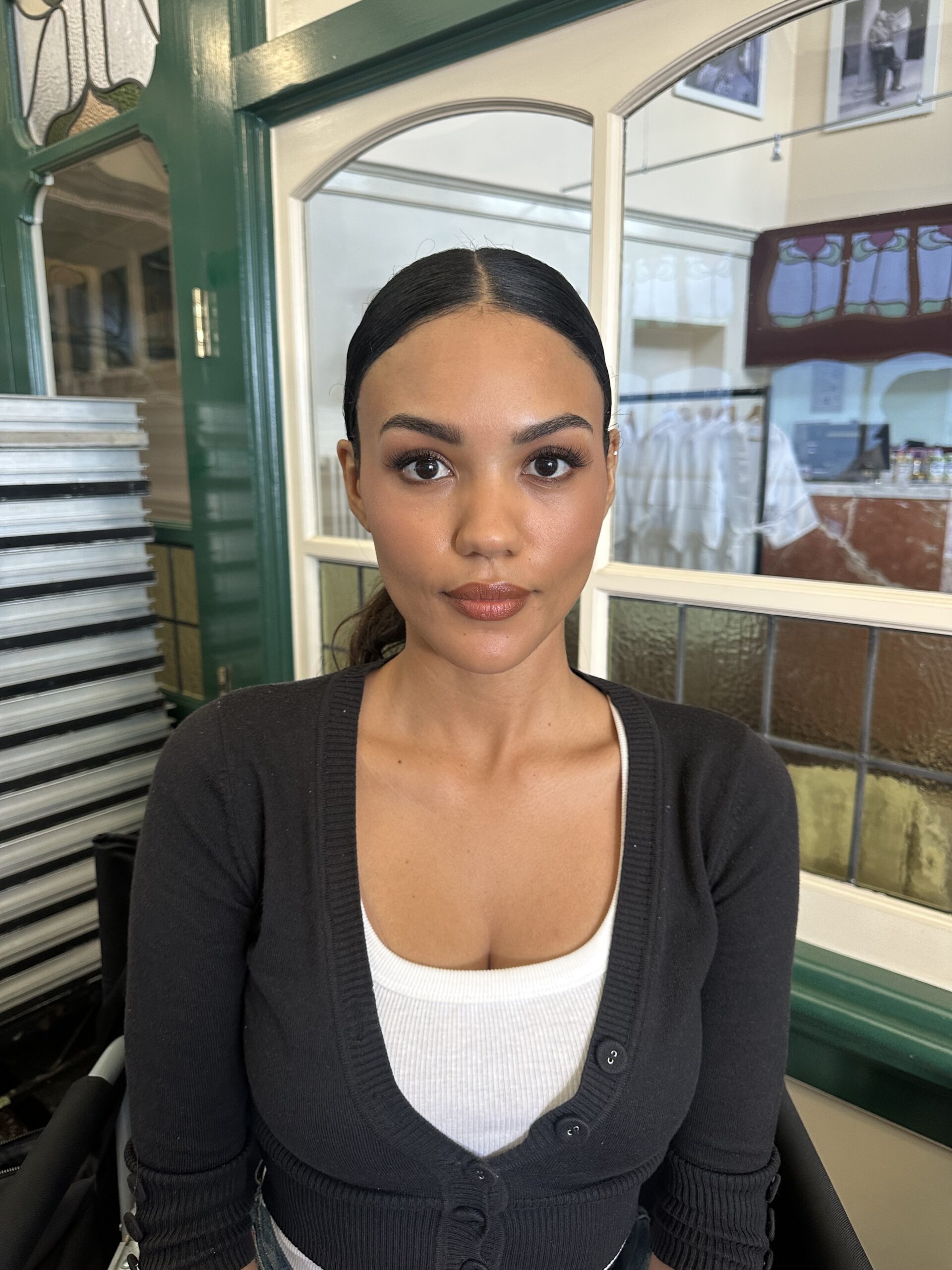 Defined eyes and warm brown lips on a model with dark hair